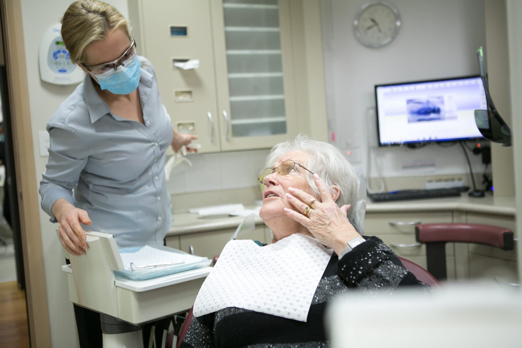 Dr Caitlin Oakley talking with a patient at Fresh Dentistry in Blackburn